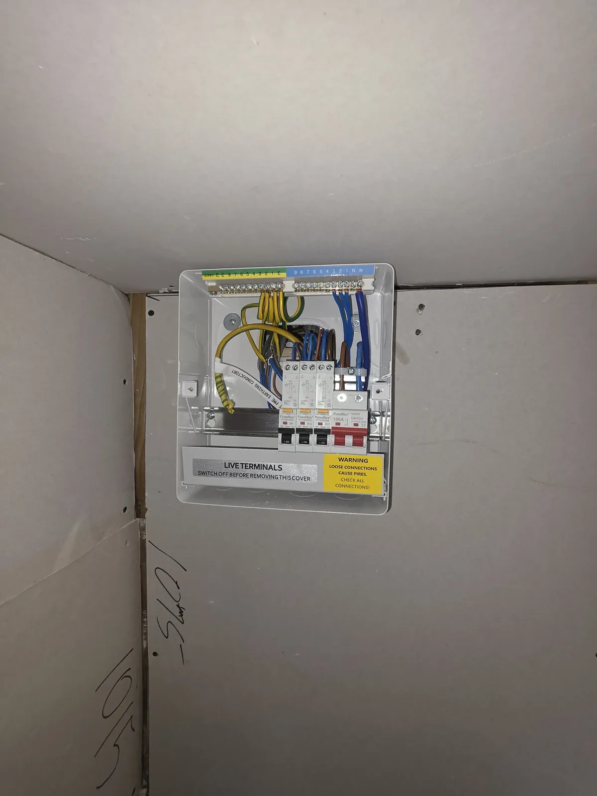 Consumer unit with the cover off showing neat internal wiring