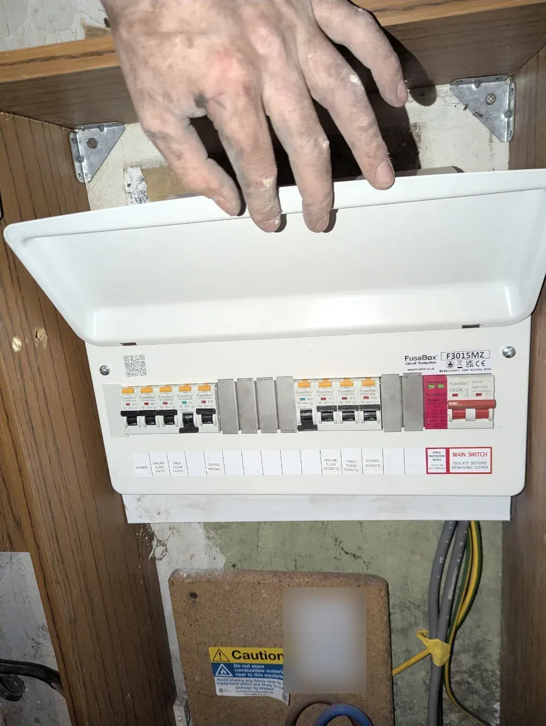 New FuseBox RCBO consumer unit with surge protection, lid lifted to show labelled circuits