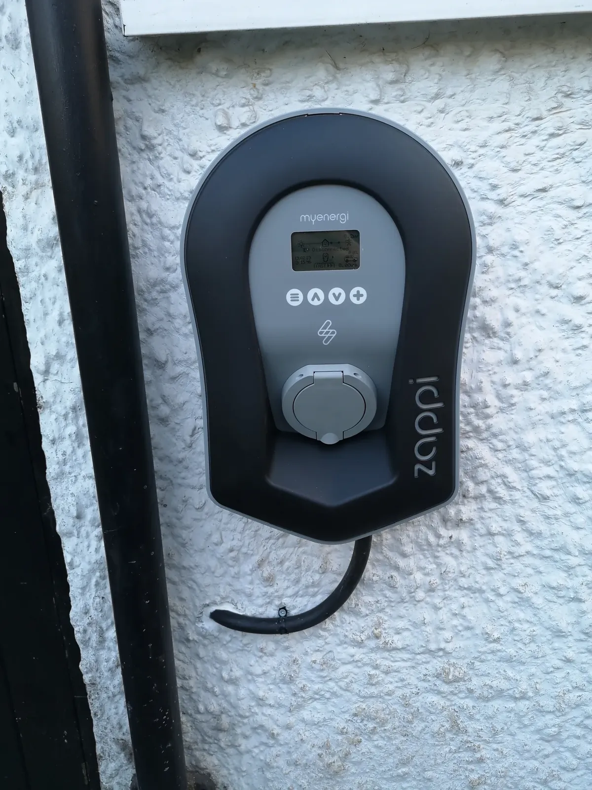 myenergi zappi EV charger installed on the outside wall of a South Wales home