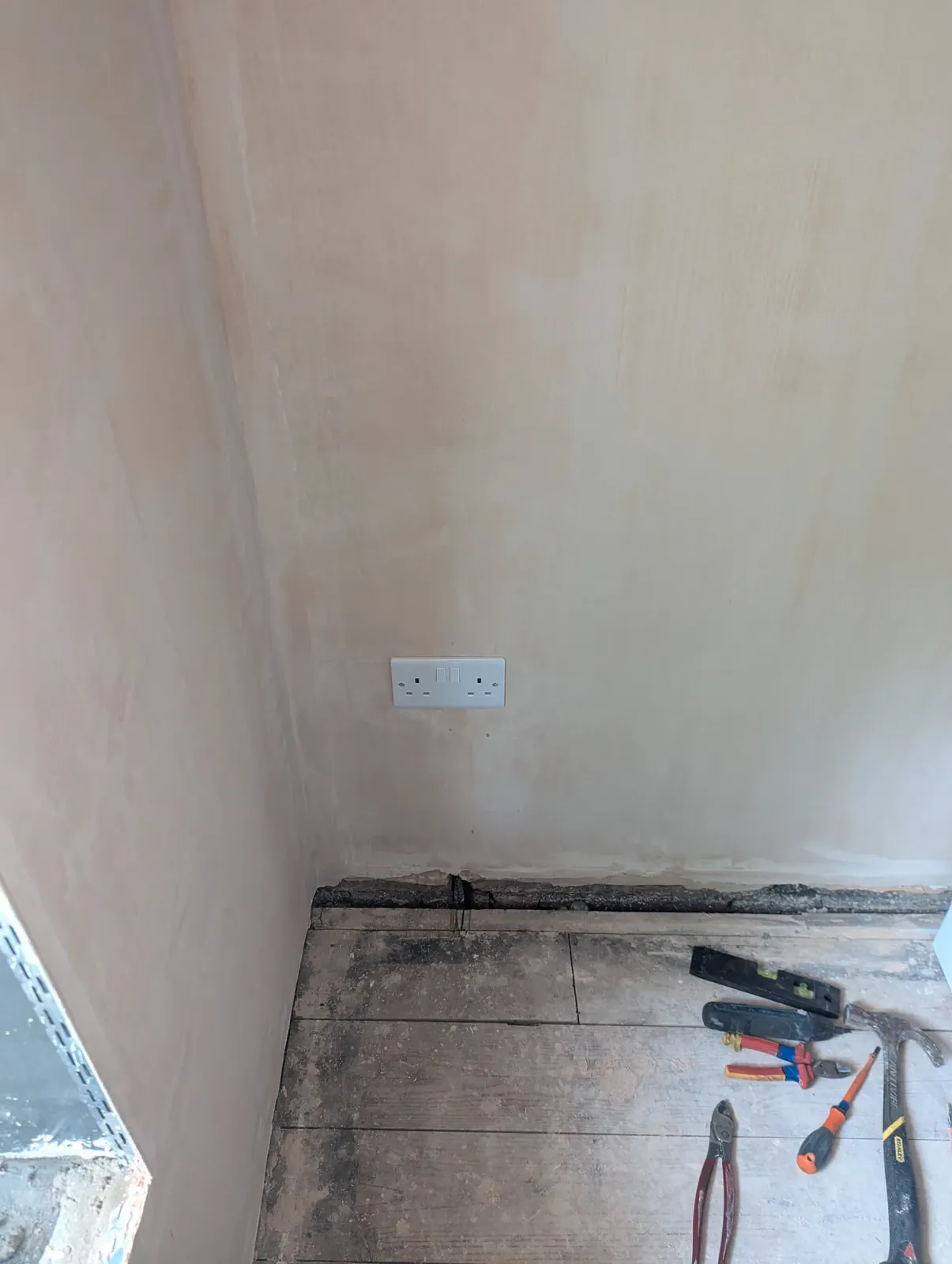 New double socket on a freshly plastered wall after a rewire