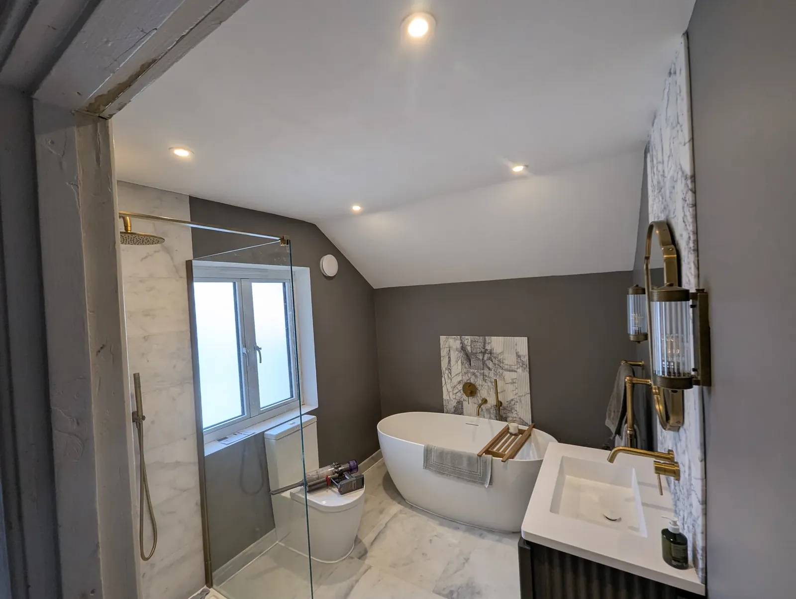 Finished bathroom with freestanding bath, walk-in shower and new downlights