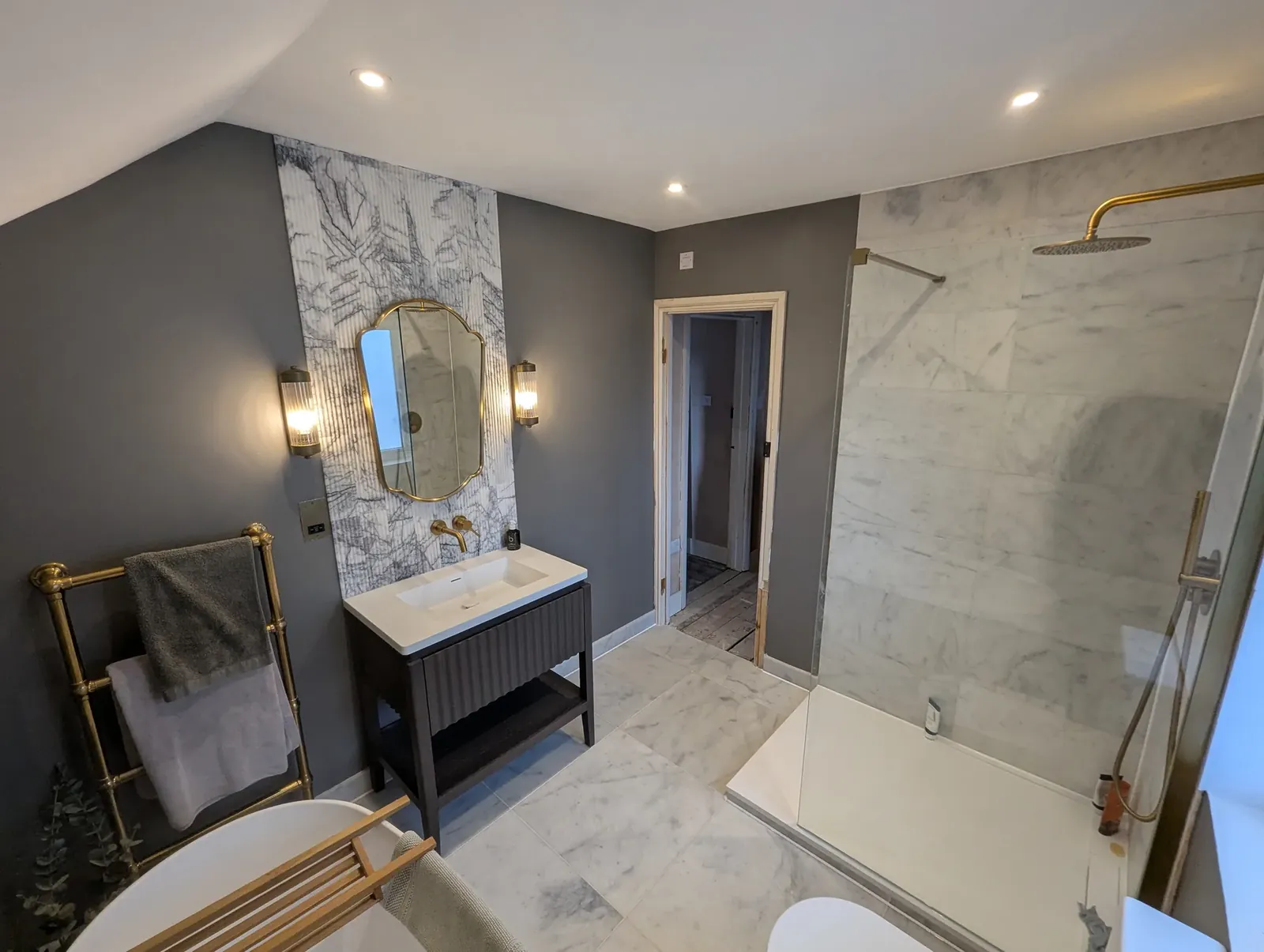 Bathroom mirror wall lights and heated towel rail wired on completion